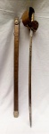 MILITARIA, uma (1) reprodução de espada, lâmina em aço sem gume, com sinais de oxidação e marca possessória CFS; guarda mão, empunhadura, bainha e pomo na forma de cabeça de leão, todos em bronze, apliques de brasões, produção artesanal e tosca, medindo 105 cm comprimento.
