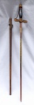 MILITARIA, uma (1) antiga espada, lâmina em aço com legendas em baixo relevo: F. A. BREW. - TABANTO ENCAMPMENT  E. M. PLATT. BOSTON MASS., sinais de oxidação; guarda mão em bronze relevado com simbologia, algumas Maçônicas, como: colunas, olho que tudo vê, etc.; pomo relevado em cortinas; empunhadura em madeira com patina na tonalidade preta, bainha em metal com cinzelados e relevados em coluna, medindo 92 cm comprimento, vide foto.