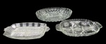 CRISTAIS/VIDROS, Lote com 3 petisqueiras, sendo: A) 2 em cristal, ricamente lapidadas em baixo relevo (25x15cm / 27,5x21cm) e B) 1 em vidro translucido, decorada em sulcos e bico de jaca (25x13cm).