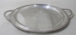 EBERLE, Bandeja redonda em metal espessurado a prata, borda cinzelada por gregas. Necessita banho. Med.: 46x38cm.