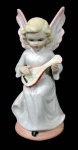 ARTE SACRA - Querubim musicista em biscuit com pintura policromada. Dedo com bicado. Med.: 14cm.