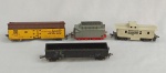 FERROMODELISMO, quatro (04) itens: 1 vagão Caboose da Trailiner Corporation 4072 manufatura REVELL Inc. 1956; e 3 da Fleischmann, Made in Germany, sendo: 1 vagão gôndola, 1 vagão de carvão e um vagão de carga Santa Fé; usados, com desgastes.