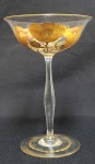 REQUINTADA TAÇA PARA TRUFAS EM CRISTAL DECORADA  COM EXUBERANTES PAPOULAS E SUAS RAMAGENS. A DECORAÇÃO É  LAPIDADA E REALÇADA EM OURO E ESMALTES. FRUTO DA MELHOR PRODUÇÃO DA BELLE EPOQUE  TEM BORDA E BASE REMATADAS TAMBÉM EM OURO. EUROPA, INICIO DO SEC. XX. 19 CM DE ALTURA