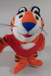 Promocional Tigre Tony Kellogg's, brinquedo de pelúcia com aproximadamente 20 cm de altura, está em bom estado de conservação.