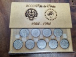 336 - Estojinho de madeira com coleção de 9 moedas de 2.000 de prata. 1924 - 1934