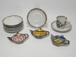 Doze itens, 3 porta-chá em porcelana pintados à mão, assinado VF 2000; 1 xícara para café e 8 pires no padrão da xícara, pintados à mão.