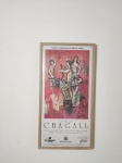 Poster de exposição: "Universo de Chagall - Museu Nacional de Belas Artes". Moldura em madeira e vidro. 62 x 32cm.