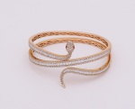 Excepcional e elegante pulseira articulada em forma de serpente, em ouro amarelo, 750k, cravejada co