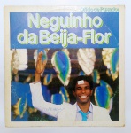 Disco de Vinil - LP - Ofício de Puxador, Neguinho Da Beija-Flor - Possui encarte com letra das músicas + Posters com imagem do artista e relatos do mesmo - Ano: 1985 -