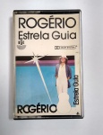 Fita k7 Orignal - Rogério - Estrela guia - RGE - Ano: 1988 - Medida: 11 x 7 x 1,5 cm.