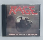 CD - Conservado e original COMPACT DISC - NOISE - RAGE - REFLECTIONS OF A SHADOW  - ANO: 1990 - CBS - Acompanha encarte. Medida: 14 cm x 12 cm x 1 cm.