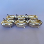EBERLE - Lote com 6 (seis) taças para sobremesa em formato octogonal com pegador e pés em bola em metal espessurado a prata. Med.: 9cm de diâmetro. Apresenta desgastes.