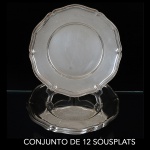 <B>Conjunto de 12 antigos "sousplats"</B> em prata alemã 835 ml, com bordas onduladas. Contraste usado a partir de 1888. Diâm. 27,5 cm. Peso 5000 gramas.