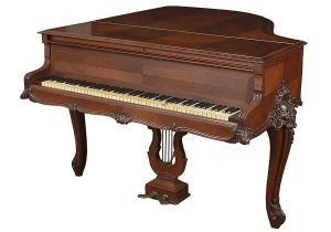 Antigo <b>piano francês "PLEYEL" </b>em madeira nobre com teclas em marfim. Pernas entalhadas com flores e volutas. Marca do fabricante no interior da estrutura. 