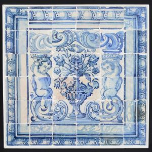 <b>Painel </b>constando de 36 azulejos portugueses do séc. XVIII decorados com figuras de anjos apoiados em volutas e centralizando vaso de flores. Bordas em arabescos. Med. 85 x 87 cm