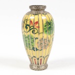 Japão Séc XIX/XX, vaso em porcelana na cor amarela com intensa decoração floral, revestido com metal prateado em forma de bambu, altura 19 cm.