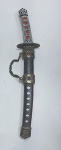 Linda e decorativa mini Katana. Lâmina de aço. Medida total com a bainha: 21 cm 4 cm x 2,3 cm.