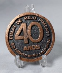 Antiga Medalha de Bronze Comemorativa 40 anos  da - DIMEP - ( Dimas de Melo Pimenta ) Empresa de Fabricação de Relógios. " A Primeira da América Latina  " - São Paulo - Brasil. Medida: 58 mm de diâmetro x 7 mm de espessura. Possui marcas do tempo.
