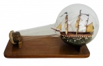 ANDREA BRANDANI - Fragata constituição naval apoiada sobre base de madeira. Acompanha certificado do artista. Mede 32cm.