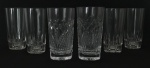 Lote contendo seis copos para água em cristal translúcido com lapidações distintas. Mede 14cm de altura.