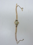 JÓIA - Antigo relógio de pulso feminino da marca FARO, com 17 cm de comprimento aberto, contrastado