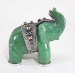 Antiga escultura oriental no formato de elefante, esculpida em Jade verde, aplicação e patas com detalhes em Prata, adornada com pedras naturais, entre elas: Granada, Citrine, e outras. Med. 10 x10 x 04 cm.