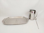 Lote 3 Peças em Aço inox sendo 1 Bandeja com alça Meridional e Jarra Suco com coador e colher suco mede 19 x 11 , 31 cm e 49 x 32,5 cm