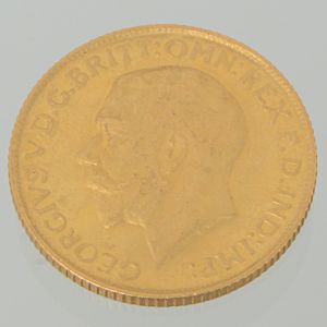 Moeda de uma libra esterlina, em ouro amarelo 22 k, tendo no verso a figura do Rei George V, datada