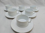 (120)Jogo de 6 xícaras de chá  em porcelana Renner Medaillon, friso prata com flores brancas.