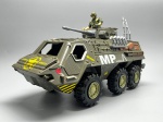 COLECIONISMO - Veículo blindado militar, Esquadrão de Resgate com metralhadora de soldado, modelo de tanque deslizante de camuflagem. Med. 16x36x14 cm. Acompanha boneco.