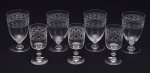 Conjunto de sete taças em cristal europeu, sendo quatro para vinho (12,5 cm) e três para vinho do porto (11,5 cm).