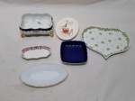 Lote composto de diversas petisqueiras, sendo 5 em porcelana e 1 em vidro opalinado. Medindo o maior 13cm x 9cm x 5,5cm de altura.