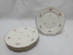 Jogo de 5 pratos de bolo em porcelana Rosenthal, friso prata com pequenas flores. Medindo 17,5cm de diâmetro.