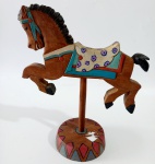 Cavalinho de carrocel em madeira policromada. Assinado e datado, 1992. Altura 22 cm.