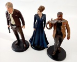 Três personagens Star Wars em miniatura.