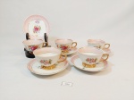 5 Xicaras de café  borda rosa sendo 2 modelos e 1 pires similar em porcelana Bohemia pintada a mão com borda rosa e ouro decorada com flores mede  4 cm x 7 cm e pires 10,5 cm