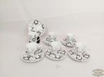 Jogo de 6 Xicaras de Café em Porcelana Decorada Branca e preto.  símbolo de estrela Medida: 6,5 cm x 6 e pires 12 cm