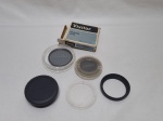 Lote de 3 filtros e 1 adaptado para câmera fotográfica. Sendo os filtros de 49mm, 52mm e 55mm.