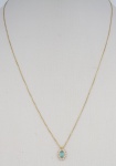 Belíssimo colar com pingente de 1 cm com pedra azul clara oval e incolores em ouro 750, med. 22 cm f