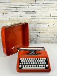 Hermes Baby - Autêntica máquina de escrever de época na cor laranja completa em ótimo estado.