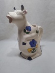 Linda jarra na forma de vaca em porcelana colorida. Medindo o bule 28cm de altura.