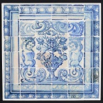 <b>Painel</b> constando de 36 azulejos portugueses do séc. XVIII decorados com figuras de anjos apoiados em volutas e centralizando vaso de flores. Bordas em arabescos. Med. 85 x 87 cm