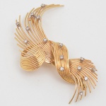 <b>Broche</b> montado em ouro 18k com 15 diamantes. Peso 12,8 g.