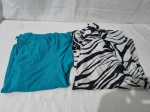 Lote de 2 camisas de manga curta, sendo uma em estampa de zebra.. Ambas tam gg