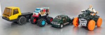 Lote com 4 automóveis de brinquedos: Um Action Man, Atom, McDonalds, com avaria. Altura: 9 cm; Uma carreta Rabaker com avaria na janela. Comprimento: 13cm; Um Ford F-650 Super Crewzer. 1/54, em ferro; Um Ice Screamer, Disney. Peso total: 390 gr