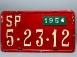 COLECIONISMO - Placa automotiva em alumínio - Vermelha - SP 5-23-12 - Com plaqueta menor 1954. Med. 20x35 cm.