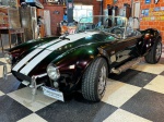 VEICULO  SHELBY COBRA 1980  Carro em muito bom estado, com um motor V8 302 e cambio automático, pintura camaleão que oscila entre verde e marrom, bancos e forração de portas em couro, 4 pneus cooper cobra novos e direção hidráulica, réplica extremamente bem feita, lataria ótima, porém precisa de alguns retoques na pintura. Documentação em dia já com placa no padrão MERCOSUL. <br><br>DESPESA ADICIONAL DE PÁTIO E LOGISTICA R$390,00.<br><br>As obras serão vendidas "NO ESTADO" em que foram recebidas e expostas. Em se tratando de automóveis, estes são leiloados no estado que se encontram no momento do pregão, não havendo garantia de funcionamento de motor e/ou elétrica, razão pela qual no período de visitação é garantida a visita por expert da confiança do arrematante.  A descrição de estado ou vícios decorrentes do uso são pontuadas na descrição dos objetos/veículos/obras, porém não vinculam e nem constituem garantia de funcionamento. </br><br>