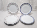 Lote de 6 pratos de mesa em porcelana e modelos diversos.  Medindo o maior 25cm de diâmetro.