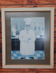 Quadro com reprodução "Le Chef", de Guy Buffet. Medidas: Moldura Altura 81,5cm Largura 70cm Tela Altura 57,5cm Largura 46cm. R2099