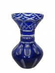 CRISTAL DOUBLE, Vaso confeccionado em cristal double na tonalidade azul, lapidado por cabochons, caneluras, losangos, dedão e filetes em baixo relevo translucido, corpo bojudo, medindo 18x10cm.